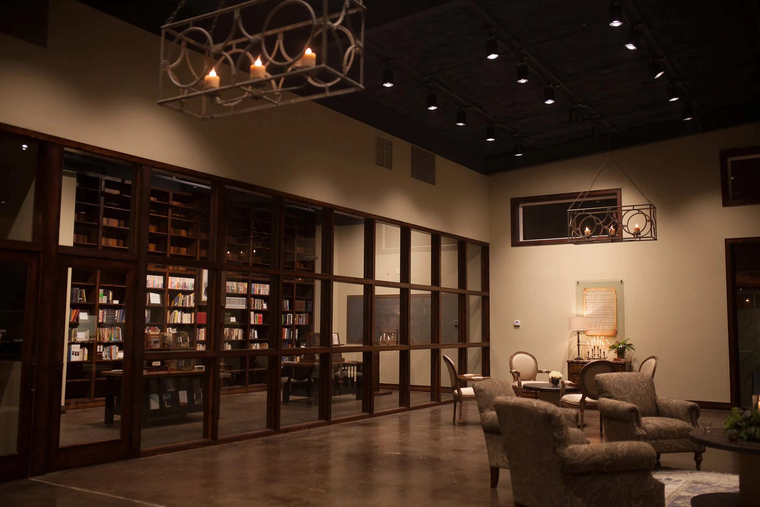 The fellowship area and library at Grace Bible Church, lit by candle chandeliers